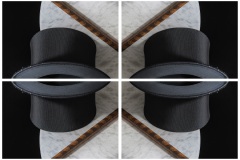 a kaleidoscope-like reflective image of 4 panels depicting a top hat and snake skin magic wand