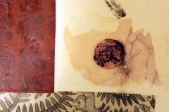 Collage of papers, oil, ink and wax on illustration board with die cuts