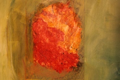a digital photograph of an orange rock from the floor of the Death Valley landscape printed on linen and collaged into a green painted field on canvas