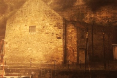 digital photograph of stone boathouse in a Scottish harbor