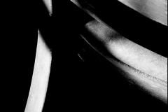 Black and white photograph of a chair detail with shadows