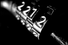 Black and white photograph close up of a bicycle lock
