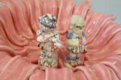 showing girl and boy figures in tongue basin.