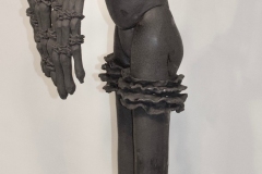 Tall hybrid poodle human form with flat black finish.