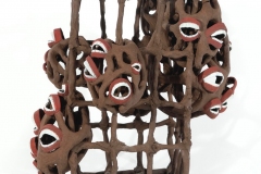 Open cage grid form with pod protrusions and smiling mouths attached.