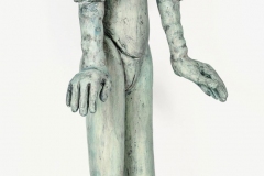 Standing female with face mask, and gloves.