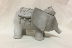 An elephant with blanket and hat