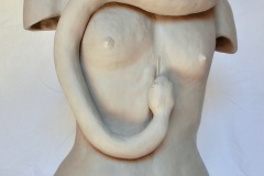 Cropped female torso, starting at hips and ending with a transition into a snake which serves as the head and wraps around the figure.