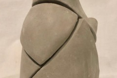 Abstract shaped jar with implied multiple openings.