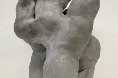 Abstract sculpture with multiple figures implied and intertwined.