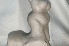 Abstract and figurative sculpted form ending in a rubic cube head.