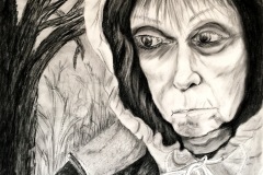 A spooky drawing of an older woman with a dead looking tree in background. The woman is hooded and her eyes are large.