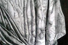 A pencil drawing og the complexity in a draped folded piece of fabric. over lapping folds are brighter and darker to create depth.