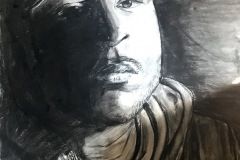 A self portrait of a stern looking fellow in a hoodie and New York Yankees hat. half of his face is illuminated, the other half is in shadow.