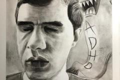 A charcoal self portrait of a man with eyes squinted shut. behind him a cartoon like ghost with teeth baring taunts him. The ghost has ADHD written on its being.