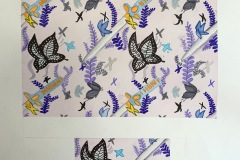 A watercolor pattern piece depicting butterfly, sword, and fern like foliage on a diagonal flow .