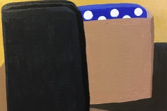 A colorful still life depicting a blocky object. A square-ish black form leans against a tan form that appears to have a blue polka-dot form coming out of it.