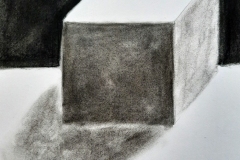 A cube with shading to show depth.