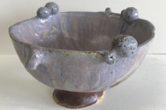 Pedestal bowl form, meteorites on surface, glazed blue-grey and brown.