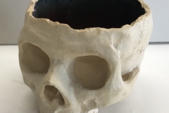skull bowl form, with red interior buff exterior