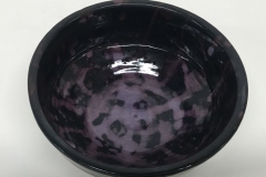 black and purple speckled glazed bowl.