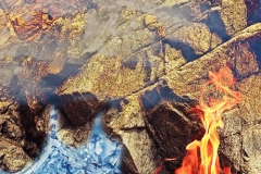 A composite landscape blending earth, air, fire and water.