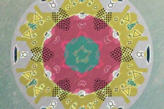 A textured background with green, red and yellow circular rings.