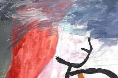 A woman with red hair underwater.