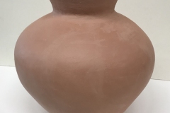Large vase form, terracotta colored.