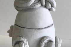 jar form with birds’ nests on surface.