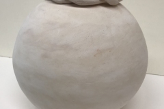 spherical form with braided form around top.