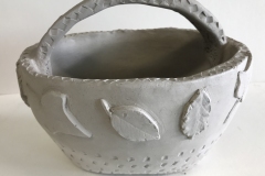 basket form with leaf forms on the surface.
