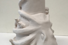 Vase form with a octopus wrapped around it.
