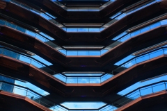 geometric photograph of the repeating pattern of balconies of a high rise building.