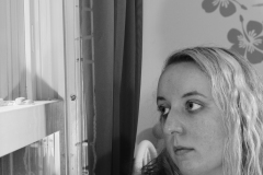 self portrait looking out window.