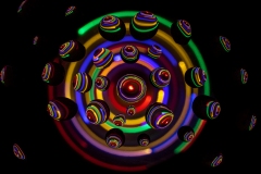 digitally edited rainbow colored balls emerging.