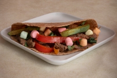 image of taco filled with veggie, meat and colored marshmallows.