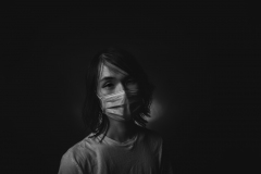 image of man with surgical mask on face.