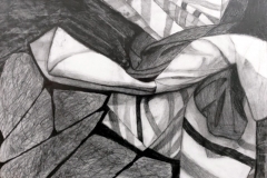still life of various fabrics folded up in a pile.