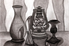 still life of various lanterns and vases on a table.