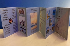 Accordian fold book depicting Quick Trips logo and brand for a travel company.