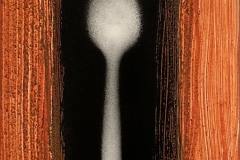 A fuzzy edged spoon is centered among an altar of thick brush strokes.