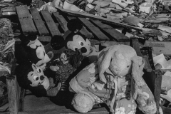 black and white photo of mickey mouse and other dolls