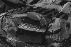 black and white photo of a decrepit piece of metal