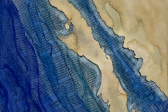 A peninsula of tan land surrounded by blue colored book pages